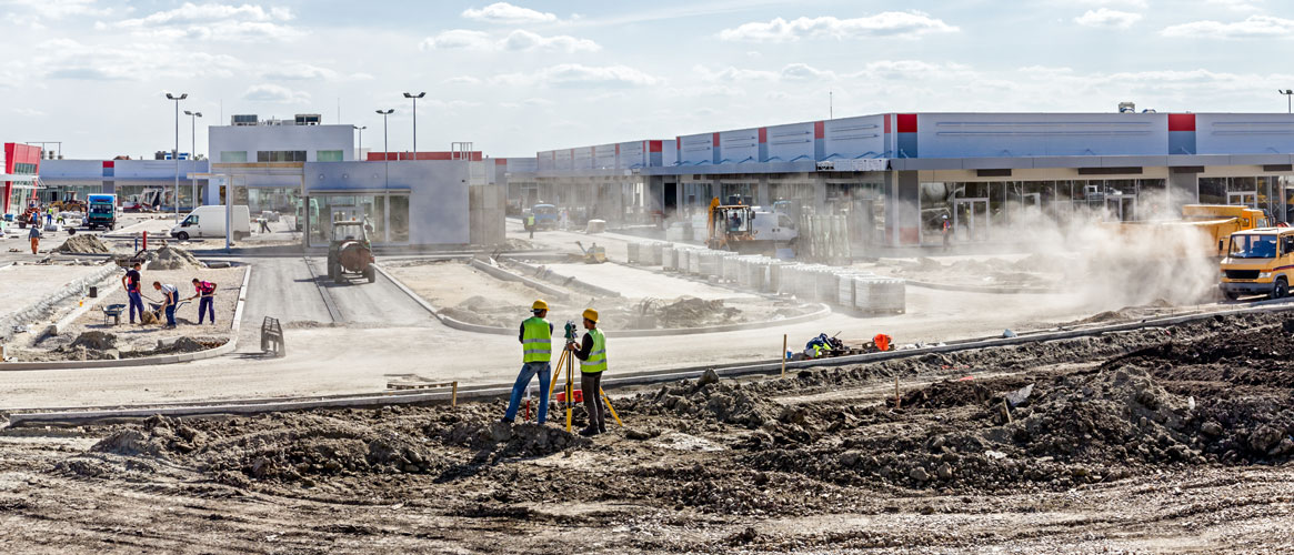 Valley dust flowing across gas station construction site