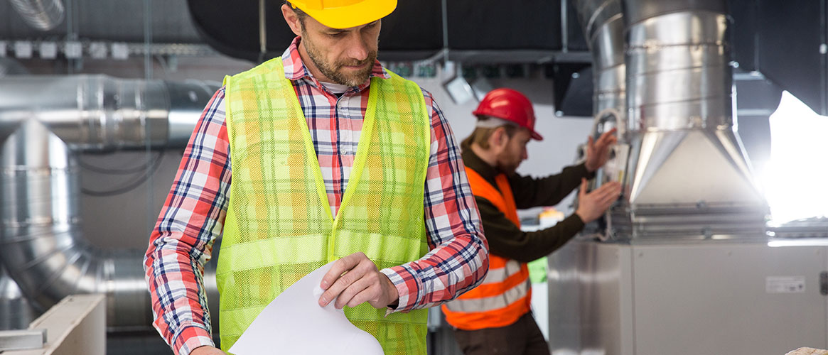 Contractor reviewing construction plans