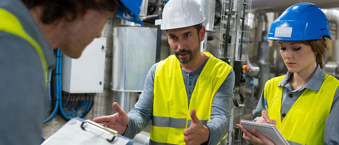 Maintenance staff reviewing earthquake plan