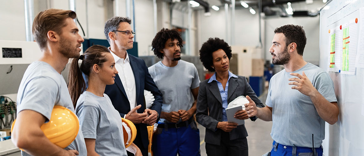 Employees meeting to review goals for measuring safety and how it has improved safety culture.