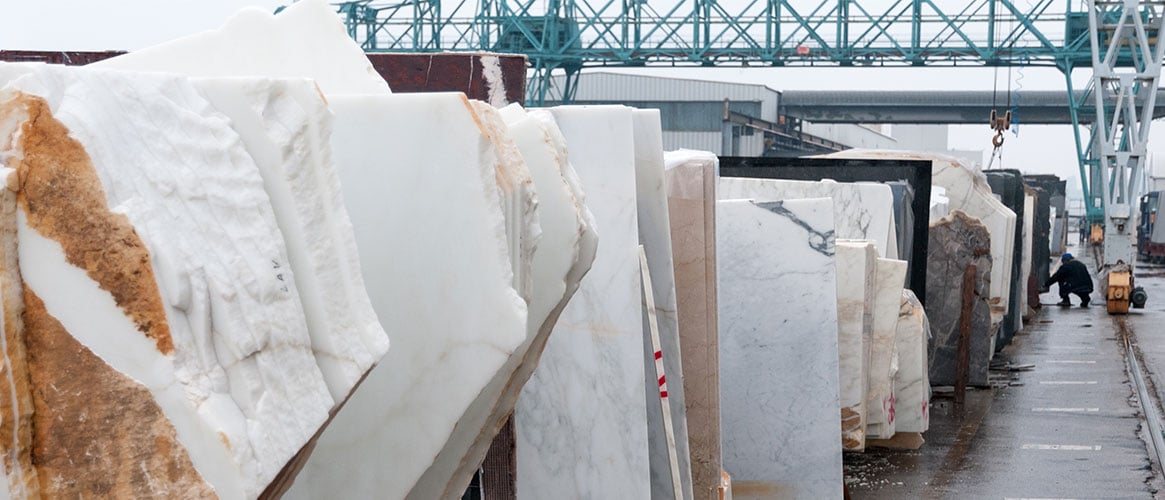 Worker selecting a stone slab