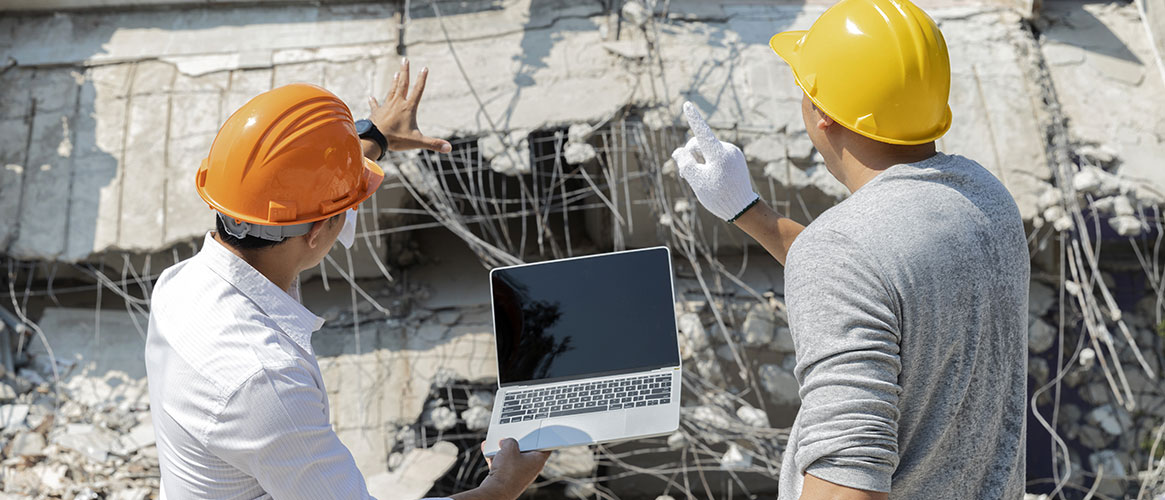 people inspecting earthquake damage