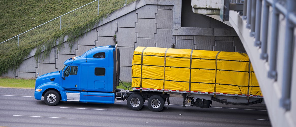 Truck bed load covered with tarp